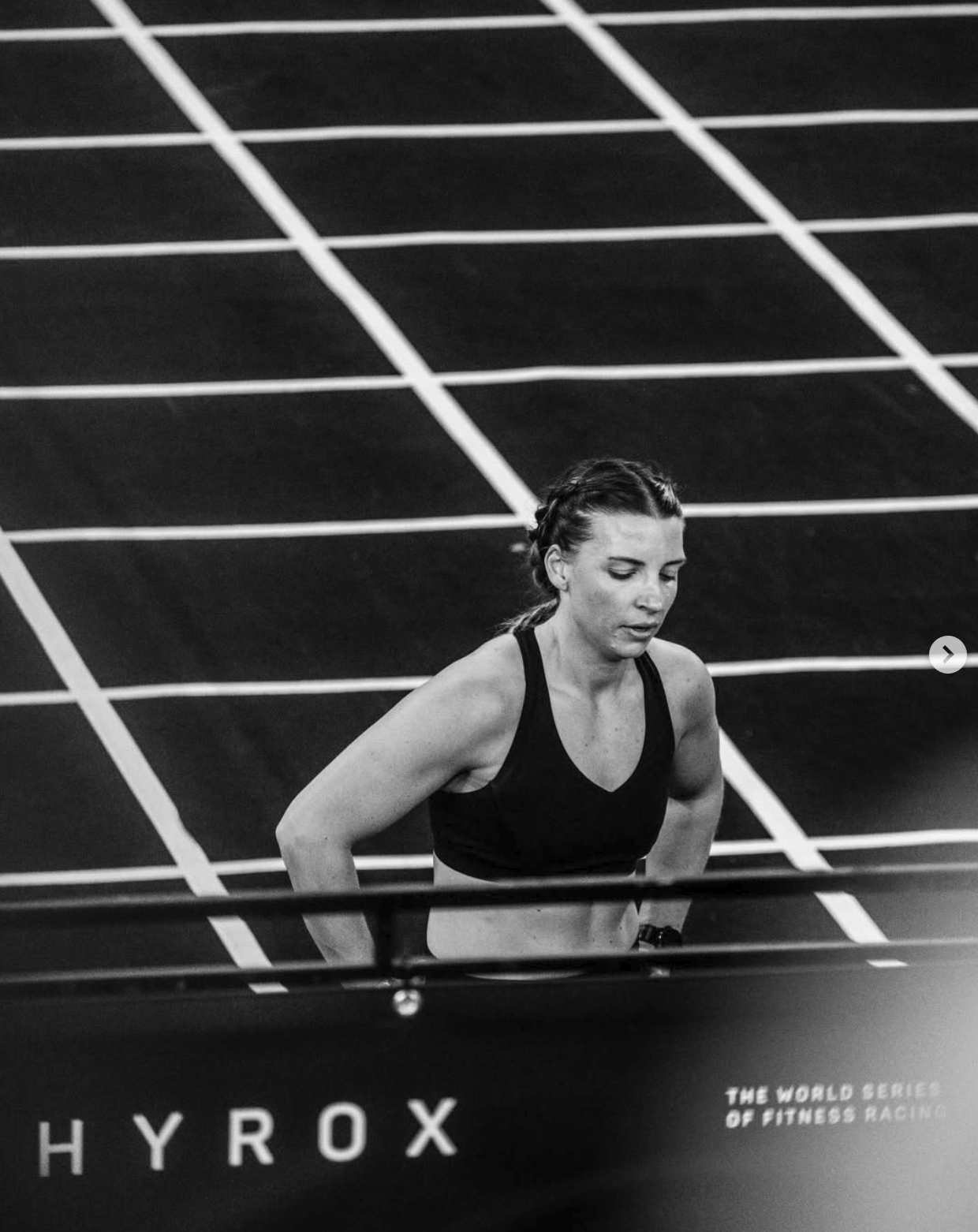 Hyrox athlete moving through the event floor in black and white